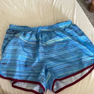 Blue Nike running shorts